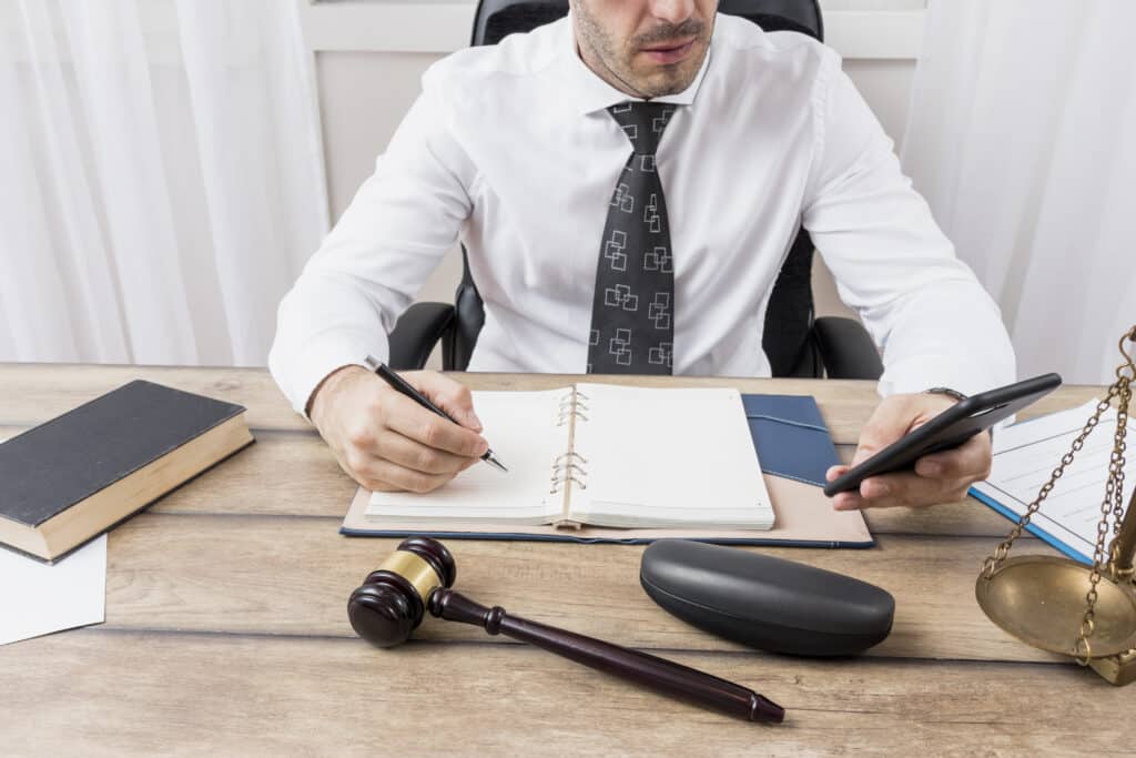 The lawyer taking notes for the client's legal annulment case