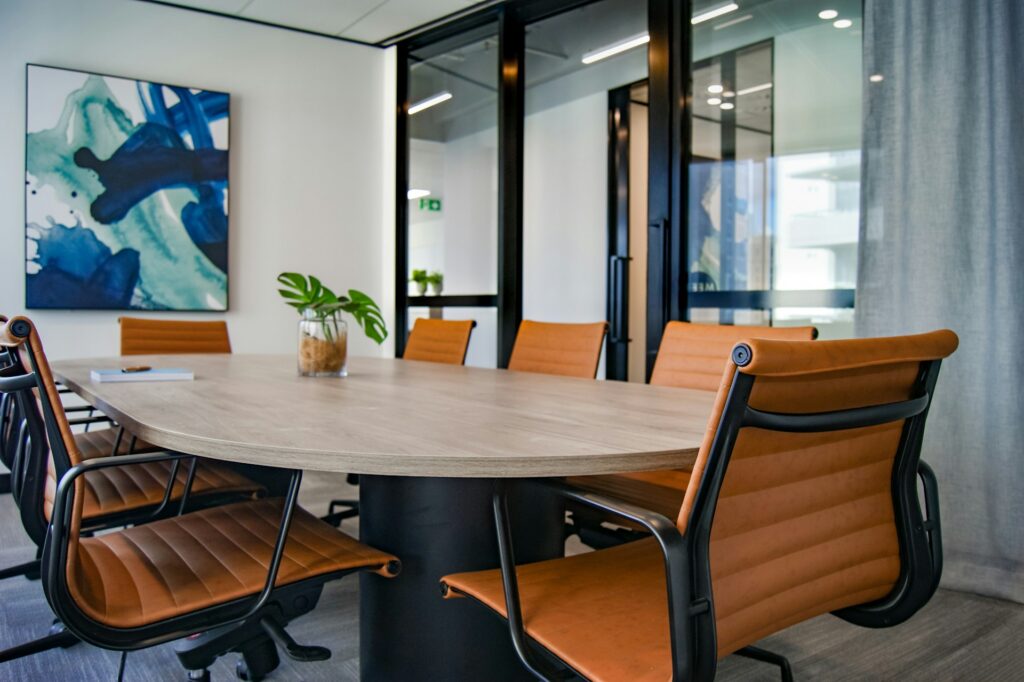 meeting room with oval desk and chairs