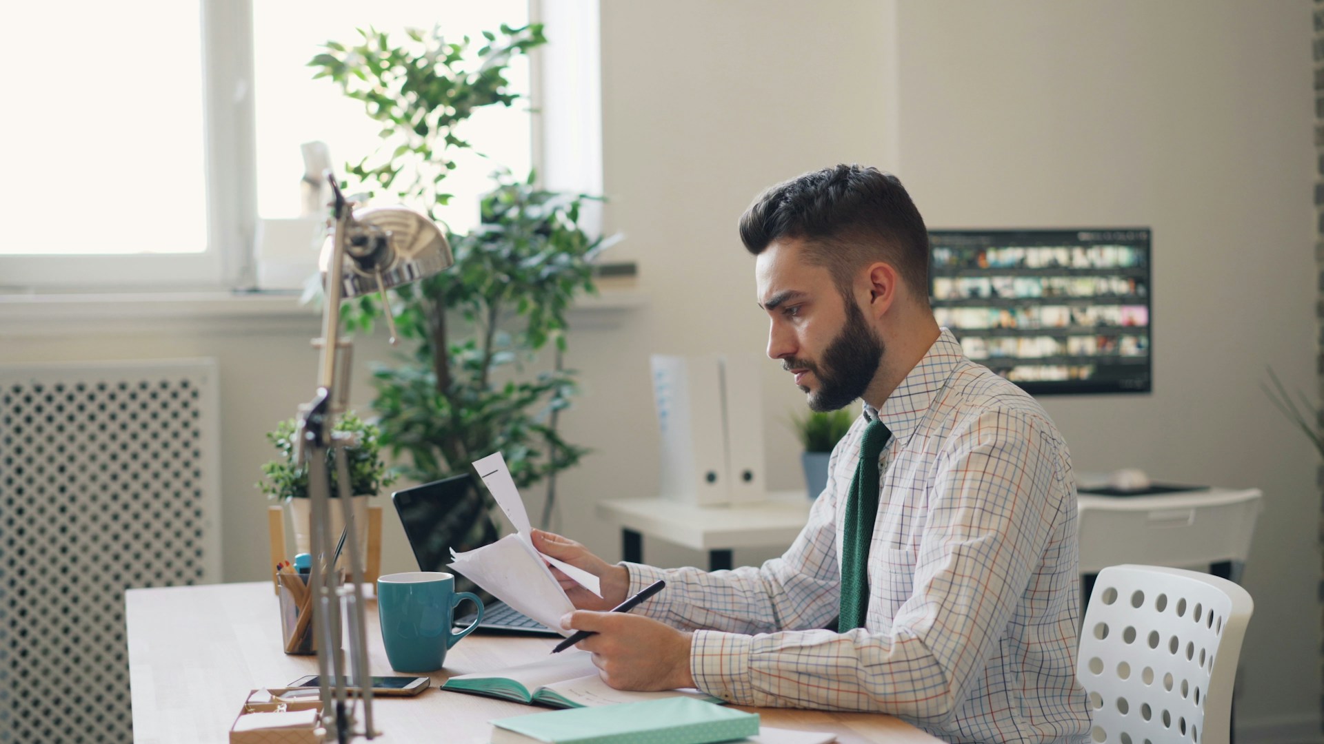 man at the office looking at documents